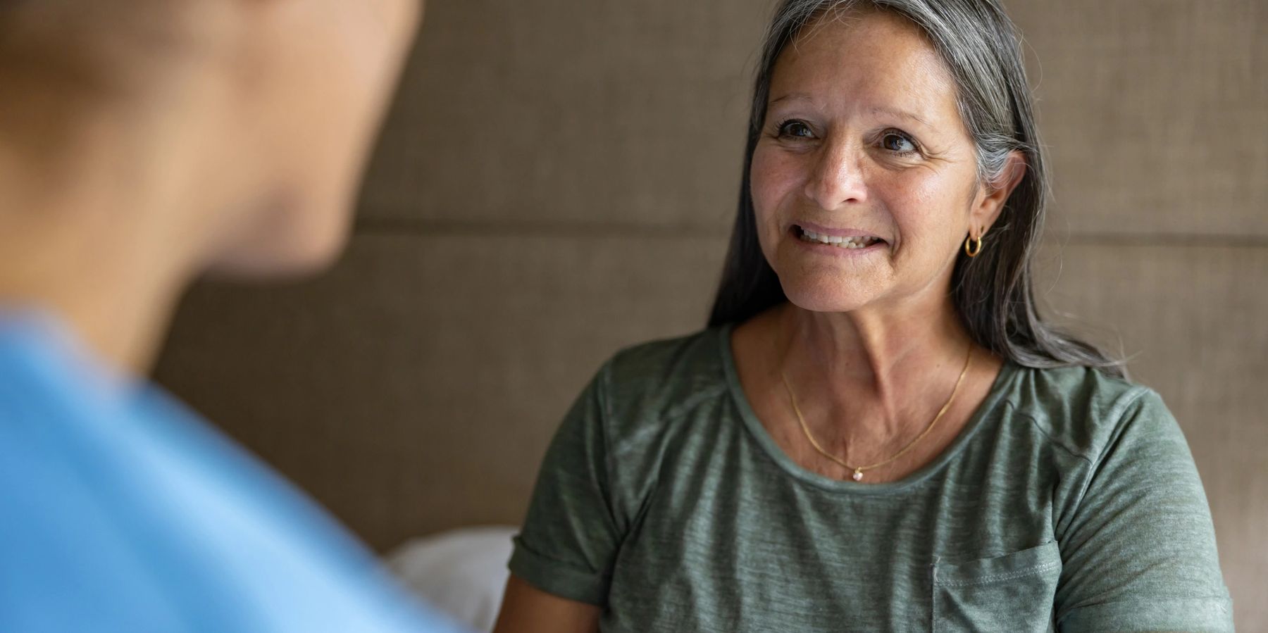 Adult patient speaking with a clinician at Crenshaw Industrial Medical Clinic